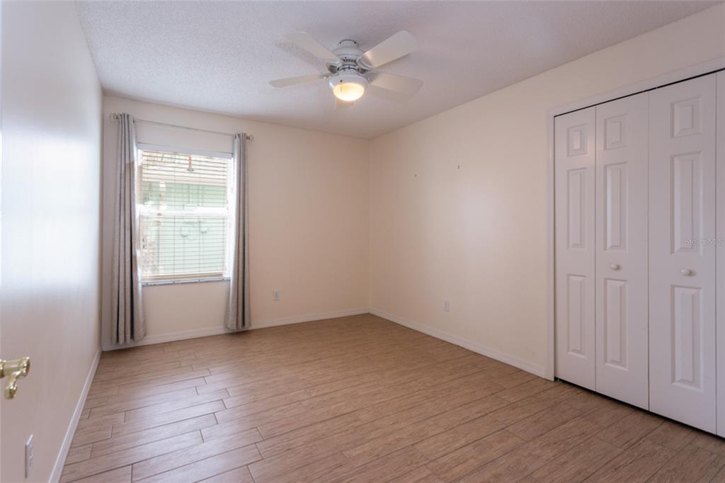 21 Comanche Court Palm Coast, FL 32137 - Photo 31 of 50 an empty room with wooden floor and windows