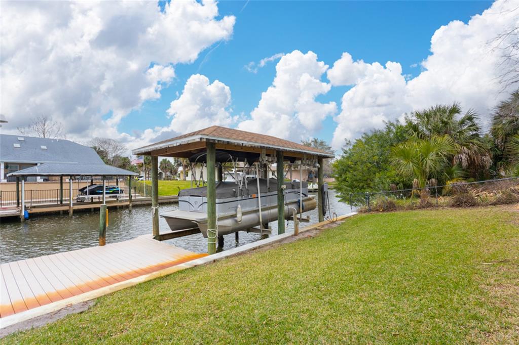 21 Comanche Court Palm Coast, FL 32137 - Photo 37 of 50 a view of a house with swimming pool and sitting area