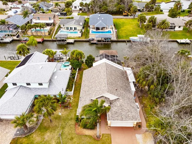 an aerial view of residential houses with outdoor space