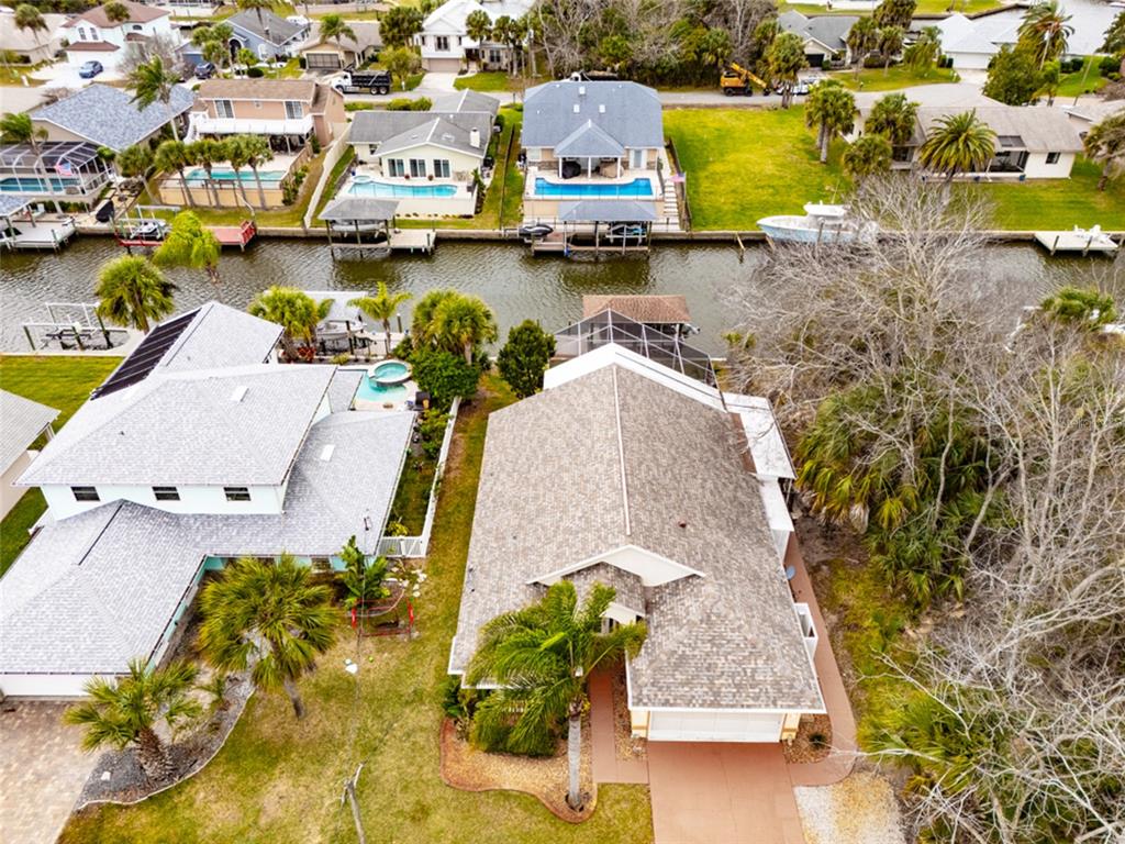 21 Comanche Court Palm Coast, FL 32137 - Photo 4 of 50 an aerial view of residential houses with outdoor space