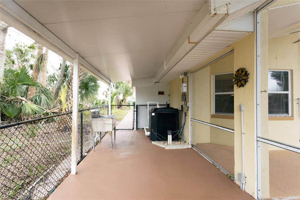 21 Comanche Court Palm Coast, FL 32137 - Photo 41 of 50 a view of living room with a large window