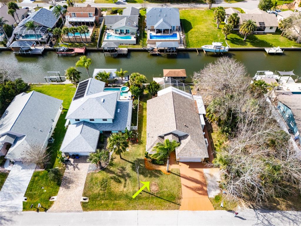 21 Comanche Court Palm Coast, FL 32137 - Photo 43 of 50 an aerial view of residential houses with outdoor space and lake view