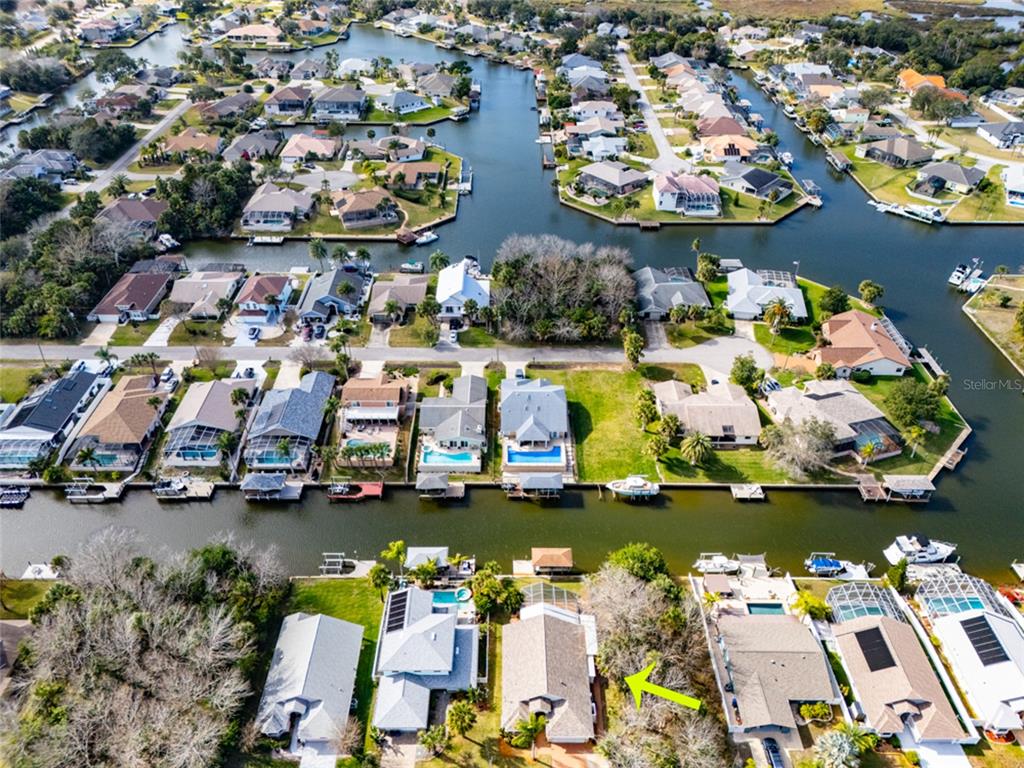 21 Comanche Court Palm Coast, FL 32137 - Photo 44 of 50 an aerial view of a houses with swimming pool and outdoor seating