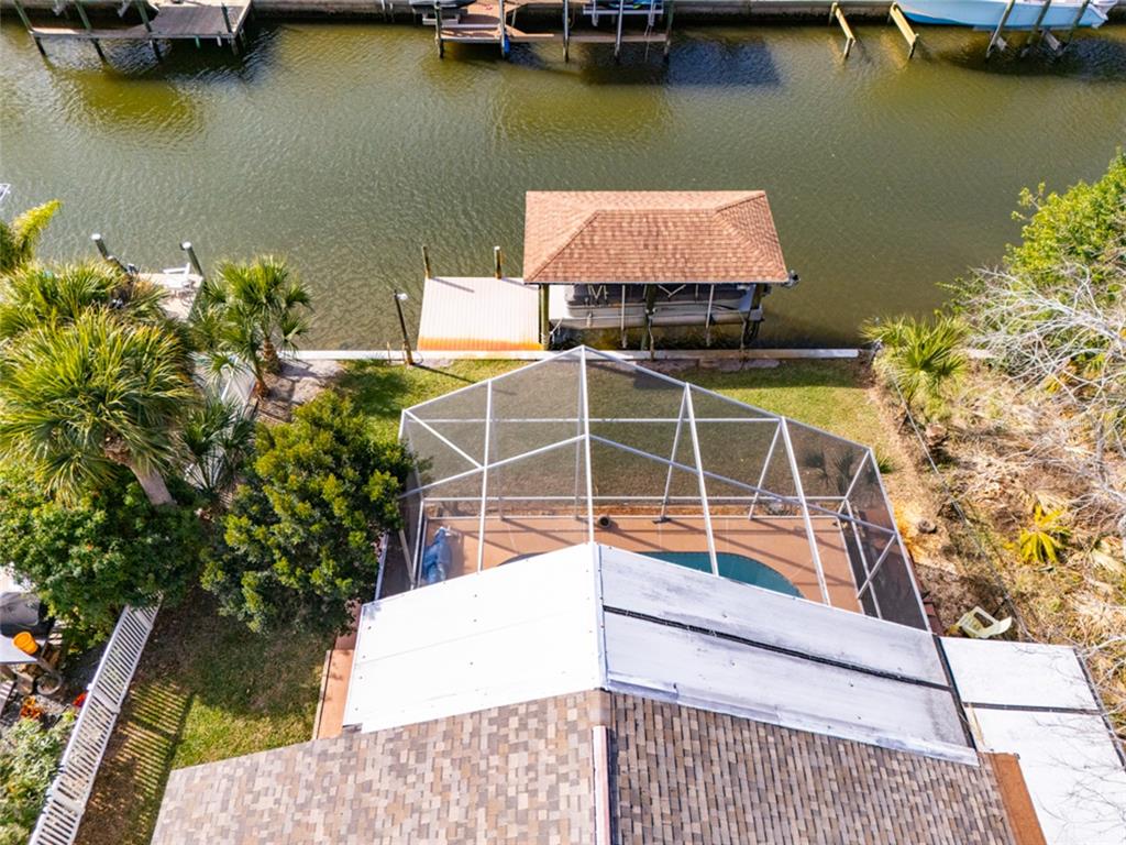 21 Comanche Court Palm Coast, FL 32137 - Photo 46 of 50 a view of a swimming pool with a lounge chair