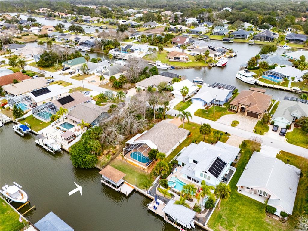 21 Comanche Court Palm Coast, FL 32137 - Photo 6 of 50 an aerial view of a house with a lake view
