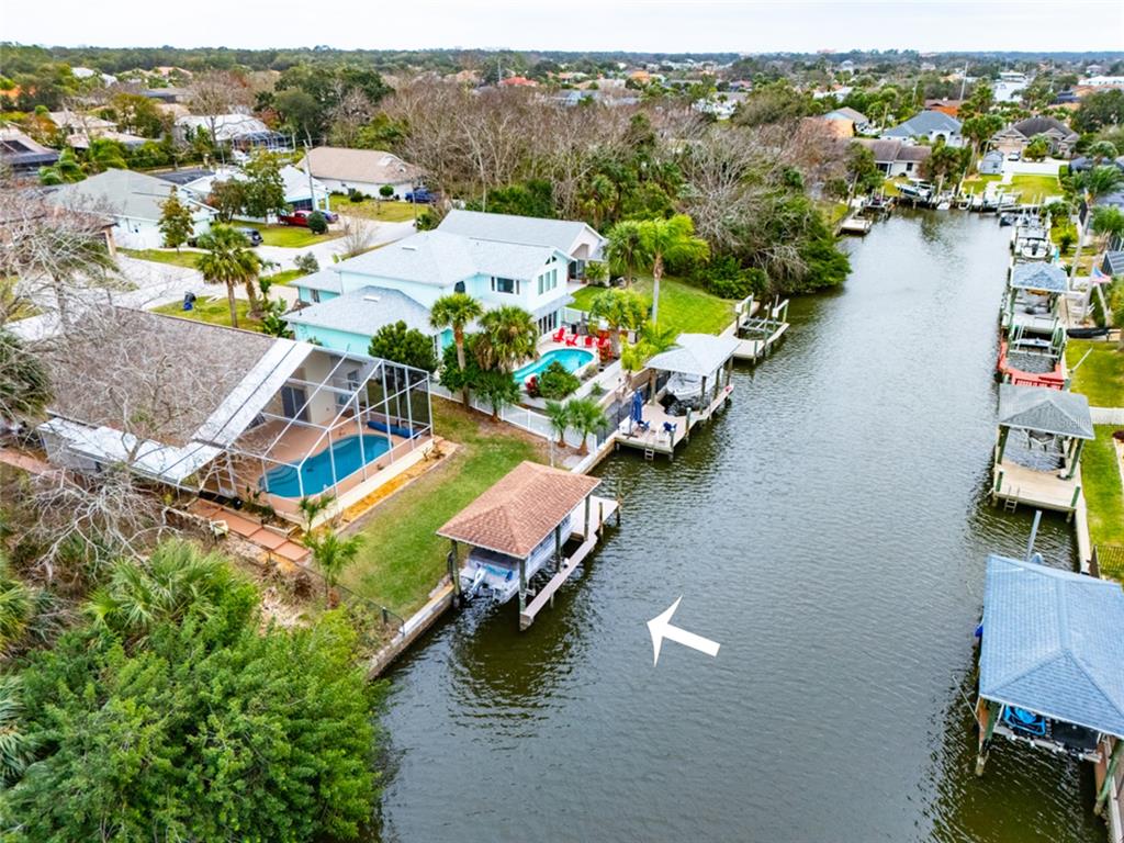 21 Comanche Court Palm Coast, FL 32137 - Photo 7 of 50 an aerial view of a house with a lake view
