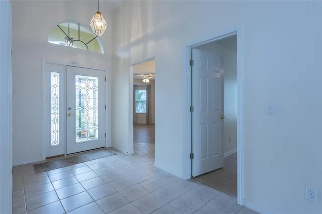 a kitchen with stainless steel appliances granite countertop a refrigerator a sink and a stove