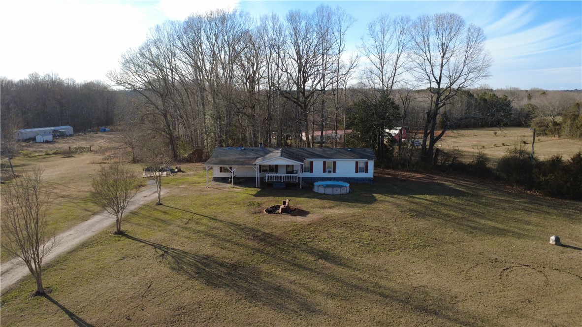 145 Finley Road Belton, SC 29627 - Photo 1 of 9 This tranquil rural property offers a charming residence amidst expansive grounds and mature trees.