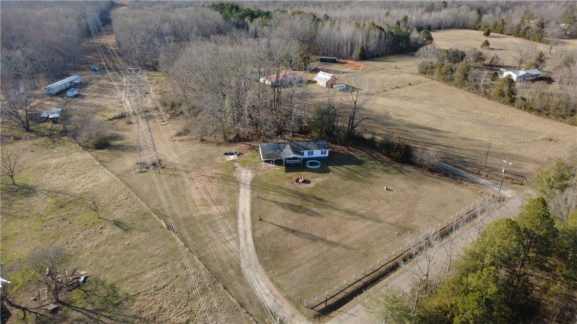 145 Finley Road Belton, SC 29627 - Photo 2 of 9 This expansive rural property offers a tranquil retreat with open fields and distant treelines.
