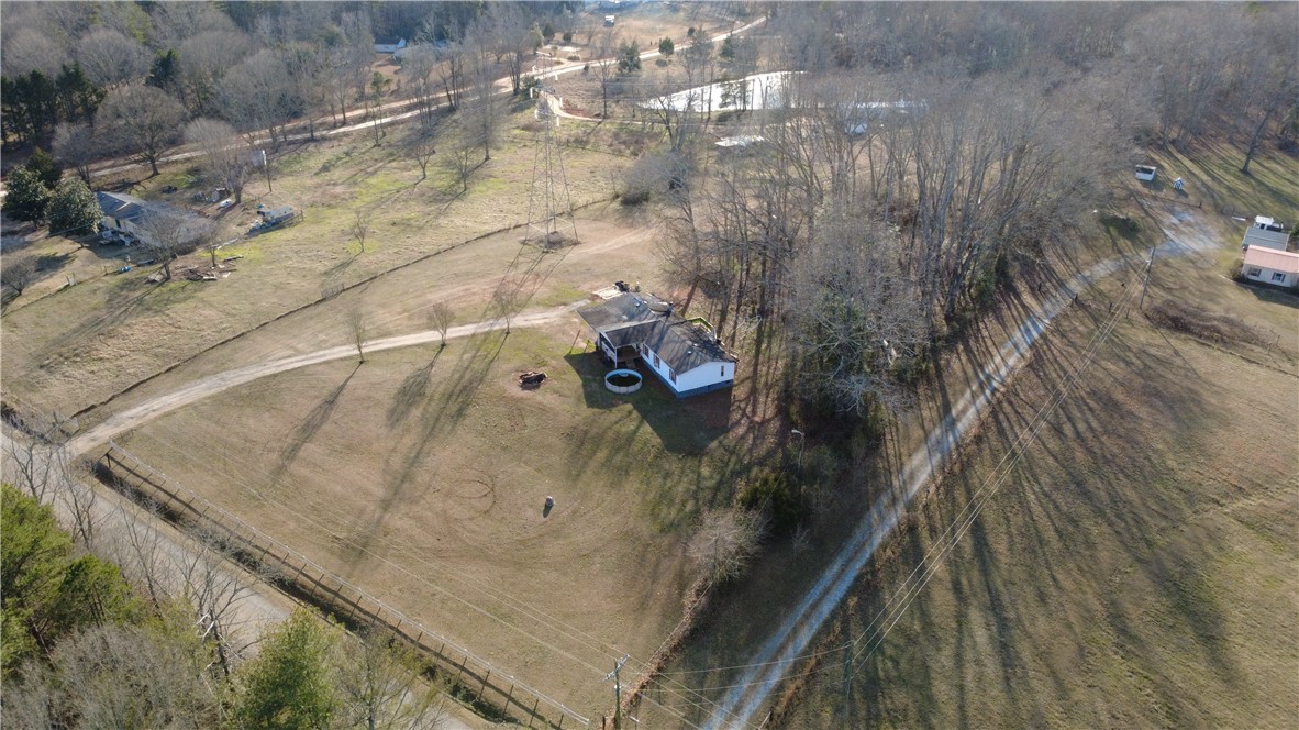 145 Finley Road Belton, SC 29627 - Photo 3 of 9 This expansive aerial view showcases a property with abundant outdoor space and natural surroundings.