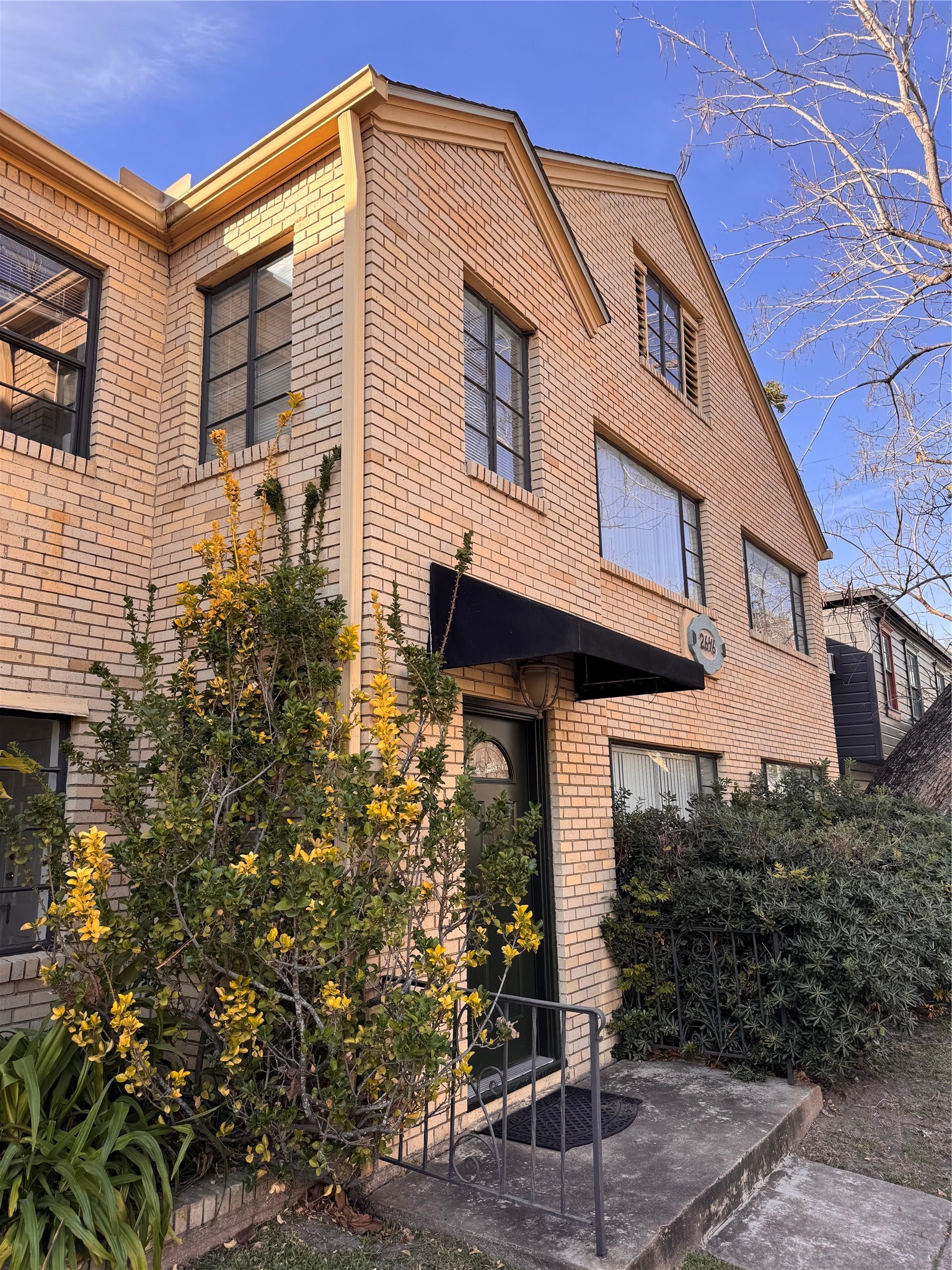 2646 Persa Street, Unit 1 Houston, TX 77098 - Photo 14 of 14 a front view of a house with garden