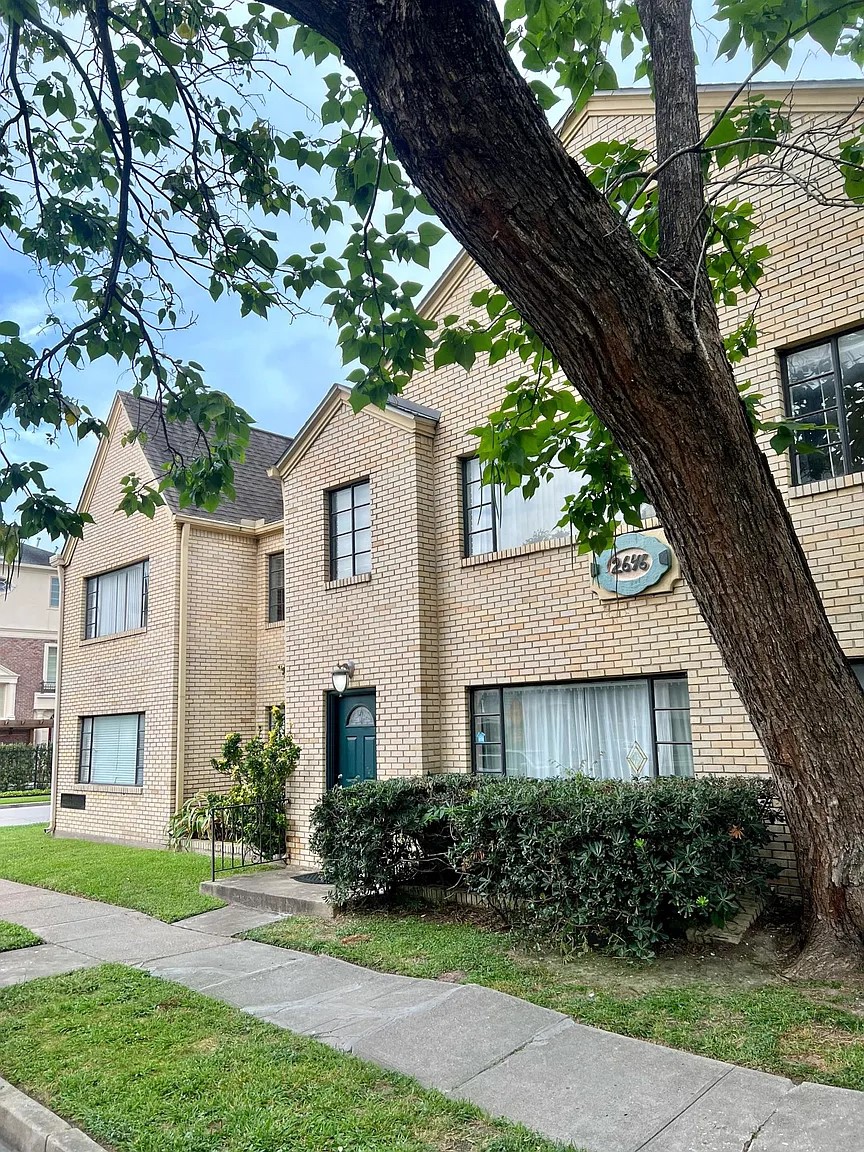 2646 Persa Street, Unit 1 Houston, TX 77098 - Photo 2 of 14 a front view of a house with a yard and potted plants