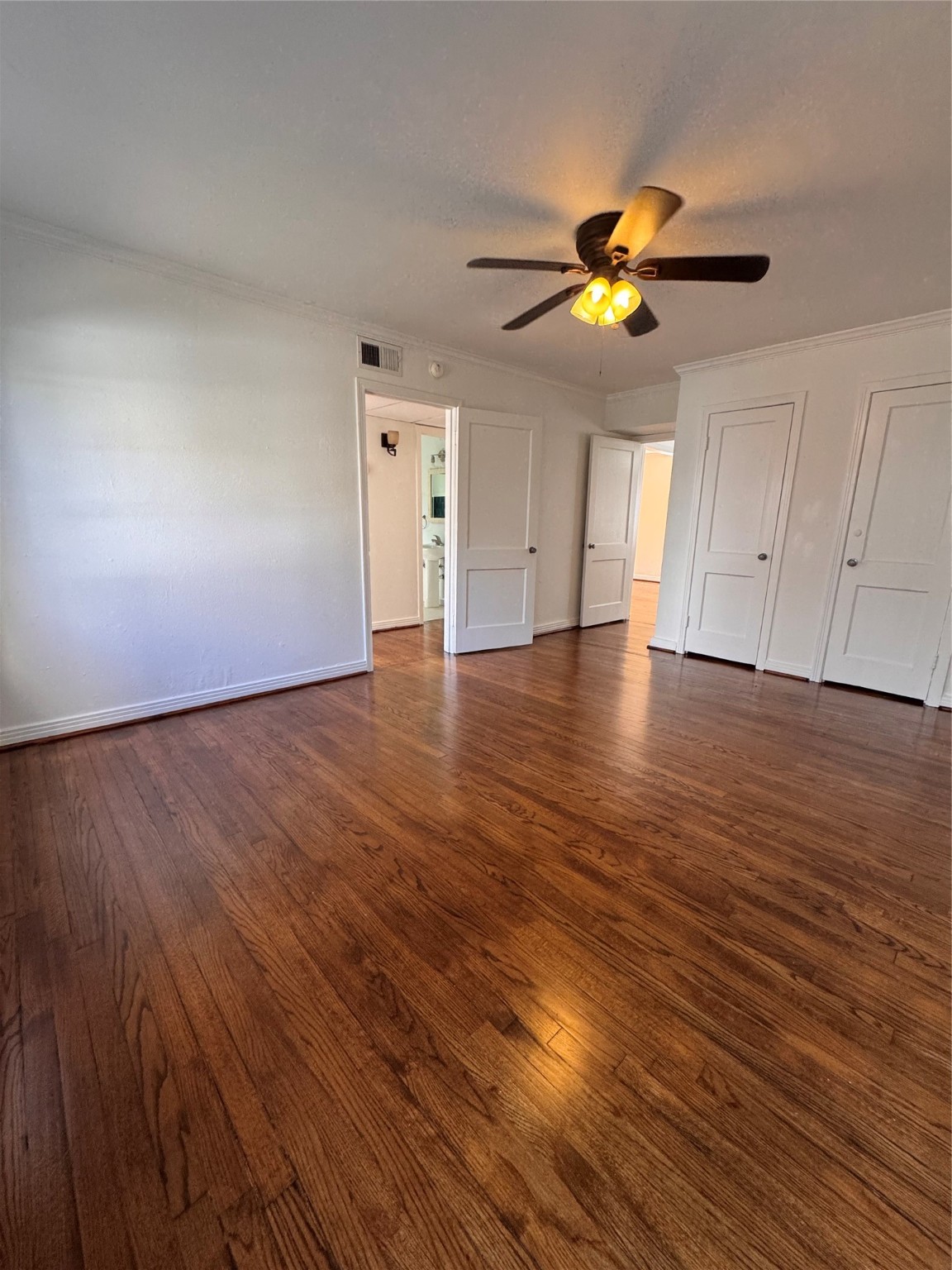 2646 Persa Street, Unit 1 Houston, TX 77098 - Photo 8 of 14 a view of an empty room with window and wooden floor