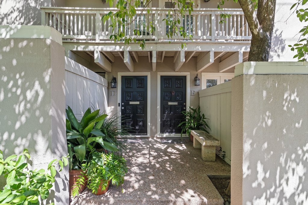 3500 Enfield Road, Unit E Austin, TX 78703 - Photo 38 of 40 A manicured courtyard, tucked beneath a lush canopy of trees, offers an enchanting approach to the front door.