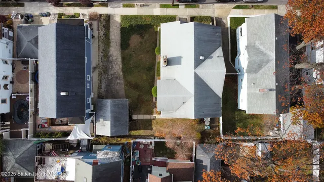 an aerial view of houses with outdoor space