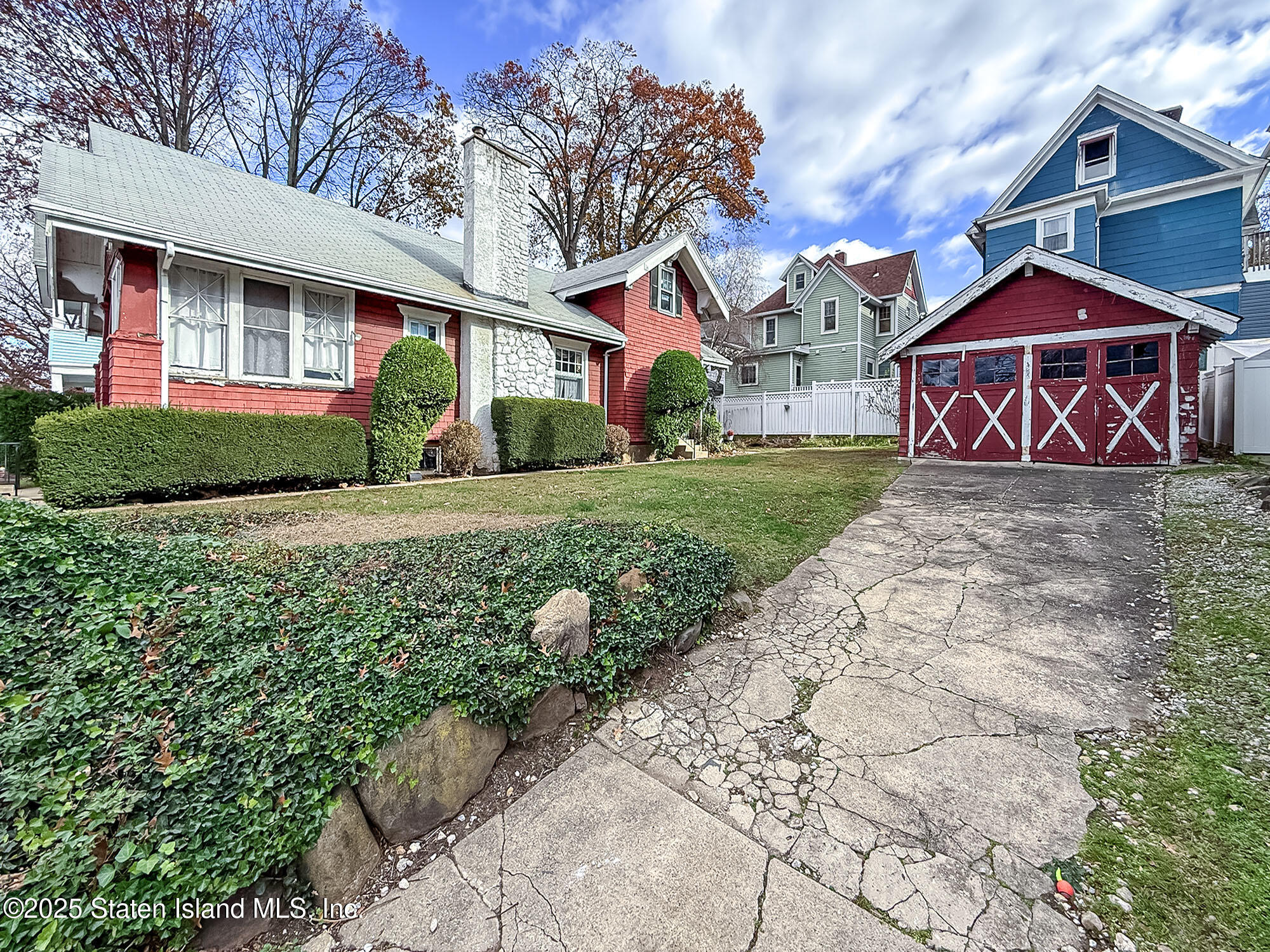153 Clinton B Fiske Avenue Staten Island, NY 10314 - Photo 6 of 7 a front view of a house with a yard