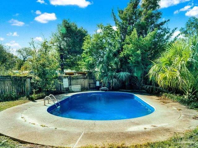 a view of swimming pool with seating space
