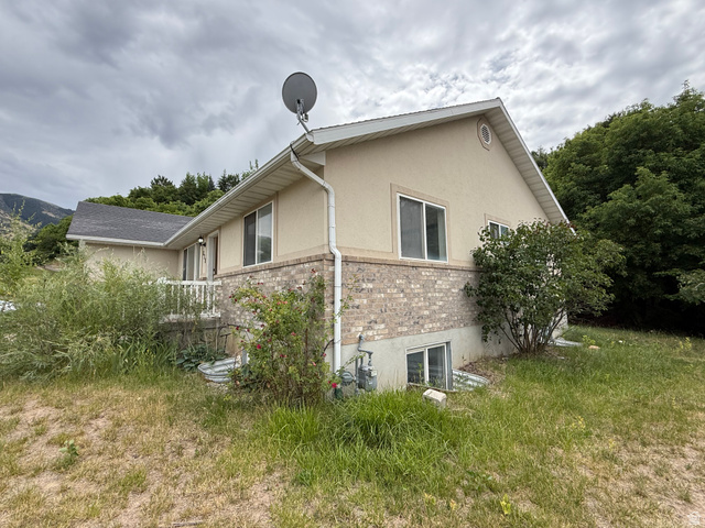 838 East Mountain Road Logan, UT 84321 - Photo 37 of 37 Exterior facade featuring a brick lower level and stucco upper level
