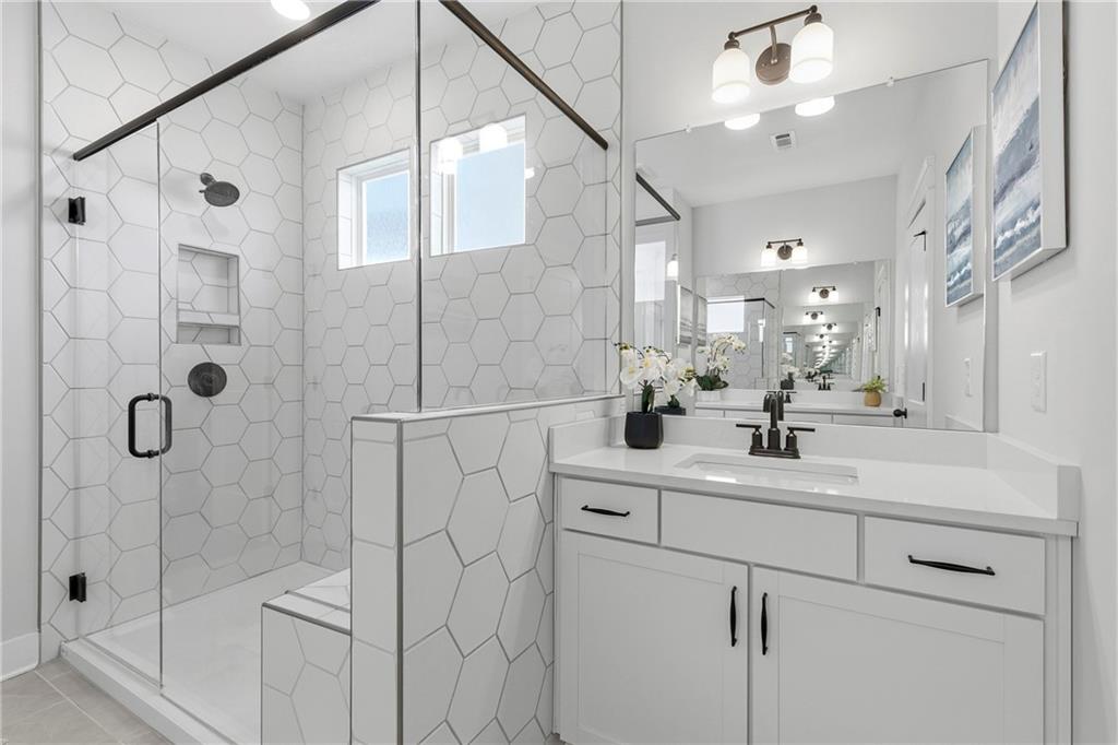 203 Sunshower Ridge Canton, GA 30114 - Photo 22 of 58 a bathroom with a sink shower and mirror