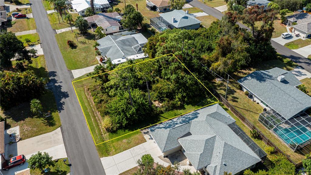 an aerial view of a house with a garden