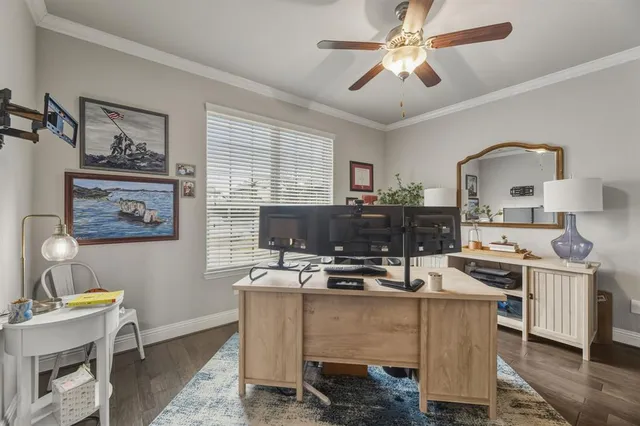 a living room with kitchen appliances furniture and a window