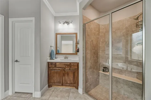 a bathroom with a shower sink and mirror