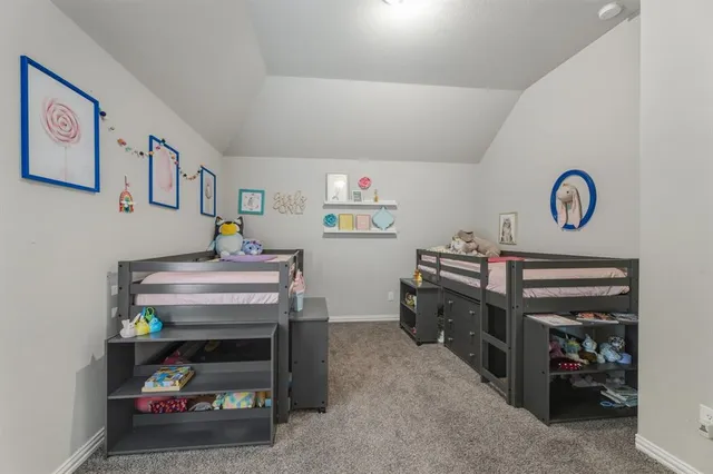 a room that has a bed and a desk in it