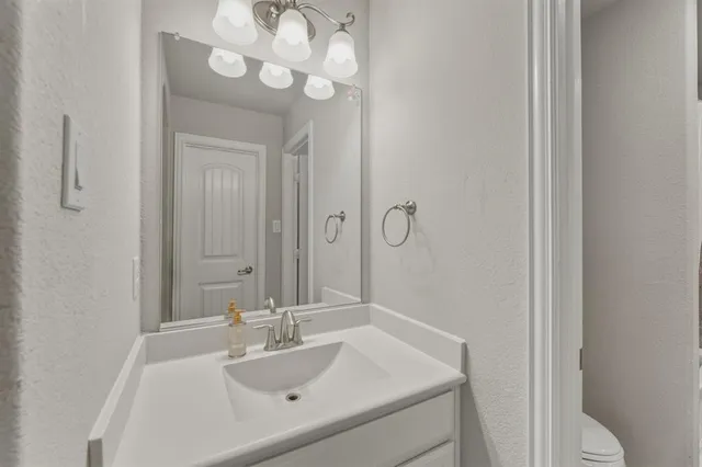 a bathroom with a sink tub and shower