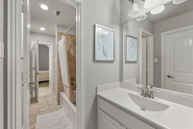 a bedroom with a bed and a cabinets