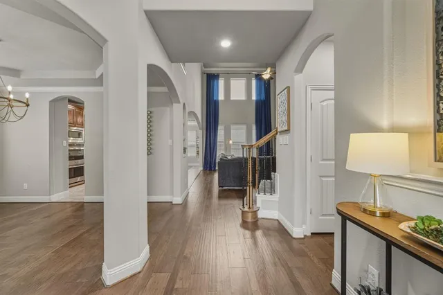 a view of entryway with wooden floor and stairs