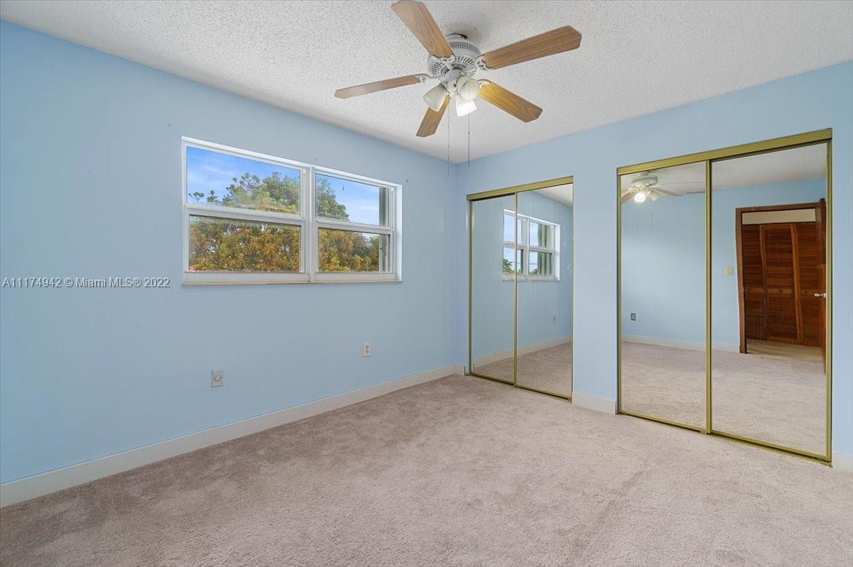 10975 Southwest 38th Terrace Miami, FL 33165 - Photo 12 of 21 an empty room with fan and windows