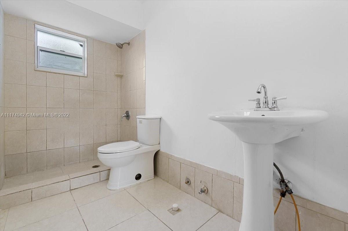 10975 Southwest 38th Terrace Miami, FL 33165 - Photo 15 of 21 a bathroom with a sink mirror and toilet