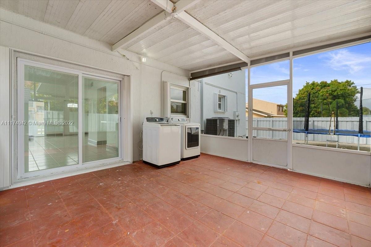 10975 Southwest 38th Terrace Miami, FL 33165 - Photo 17 of 21 a view of a kitchen with furniture and large windows