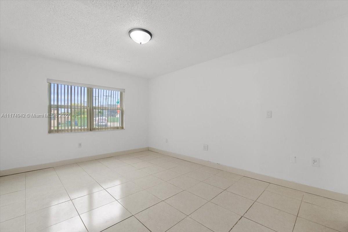 10975 Southwest 38th Terrace Miami, FL 33165 - Photo 5 of 21 an empty room with windows