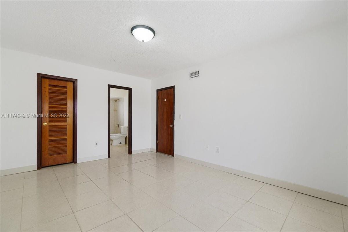 10975 Southwest 38th Terrace Miami, FL 33165 - Photo 9 of 21 an empty room with closet