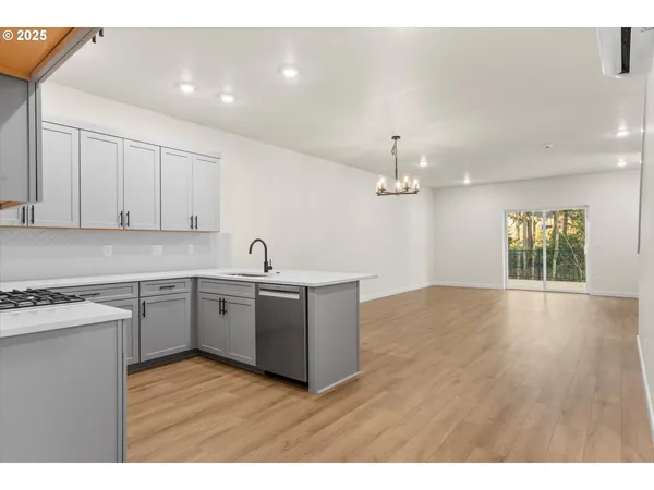 a kitchen with a sink cabinets and window