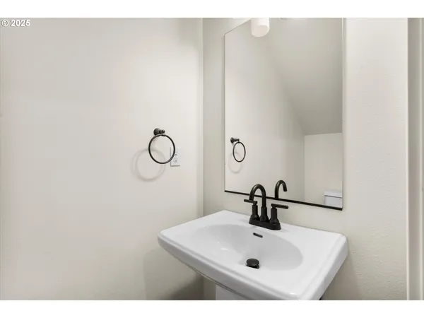 a bathroom with a sink and mirror