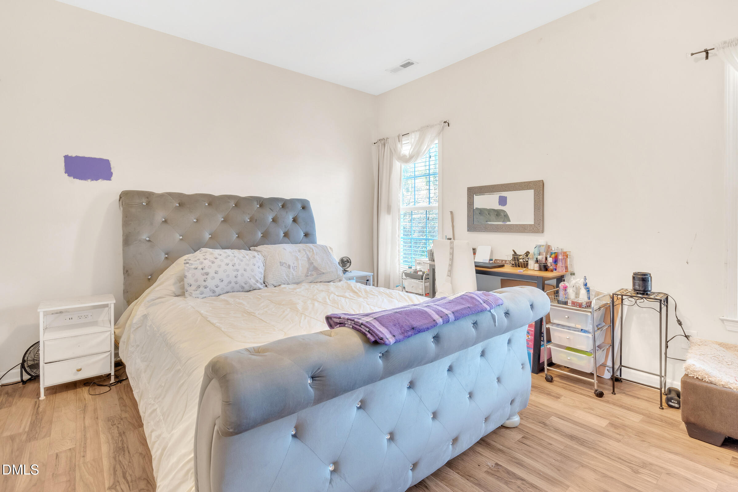 904 East Jones Street Raleigh, NC 27601 - Photo 12 of 21 a bed room with a bed and a couch