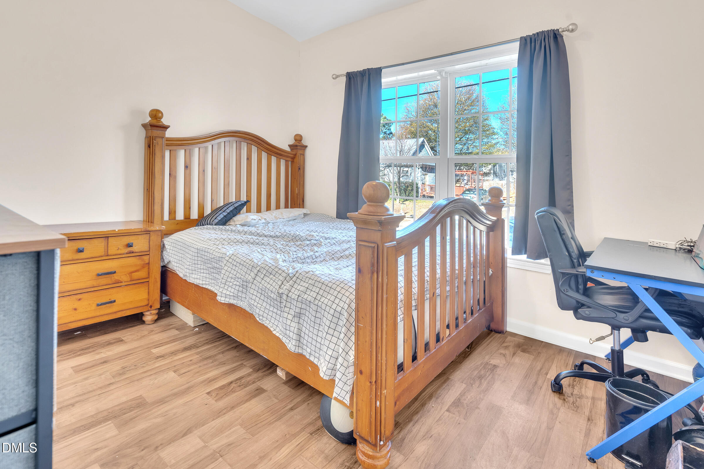 904 East Jones Street Raleigh, NC 27601 - Photo 16 of 21 a bedroom with a bed and a table