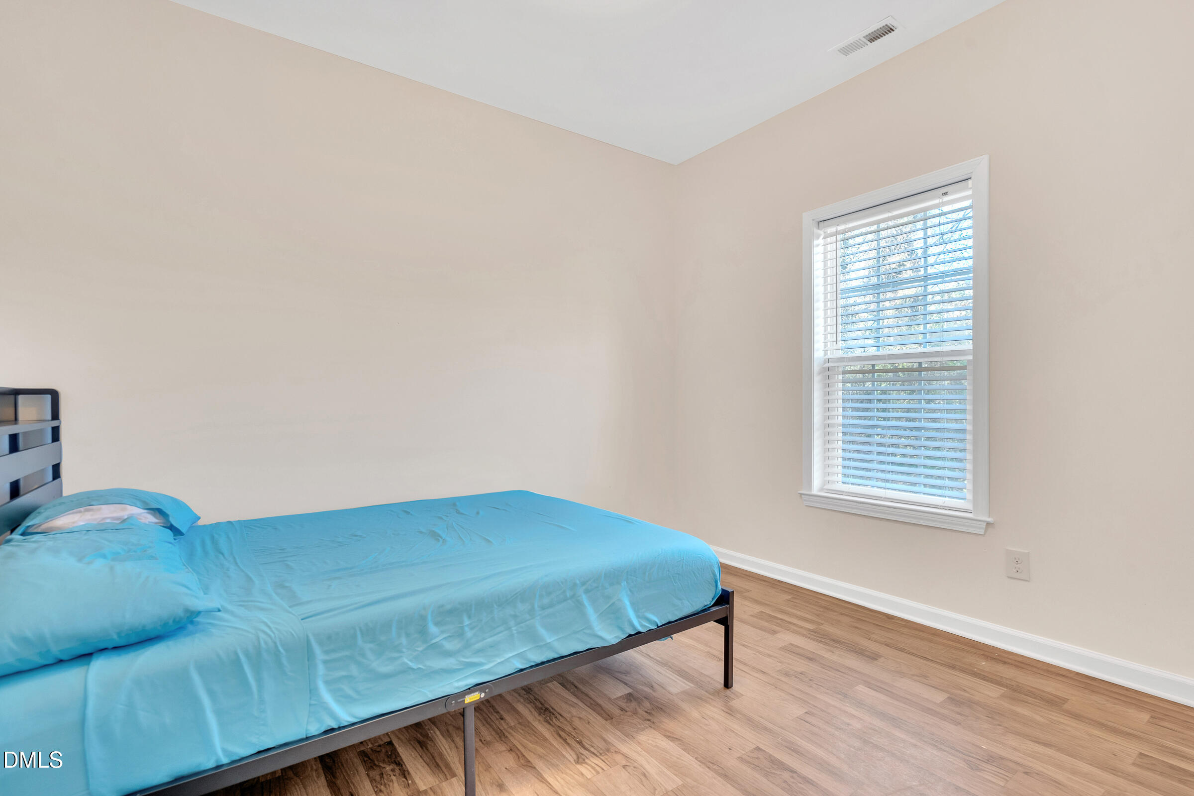904 East Jones Street Raleigh, NC 27601 - Photo 17 of 21 a bedroom with a bed and a window