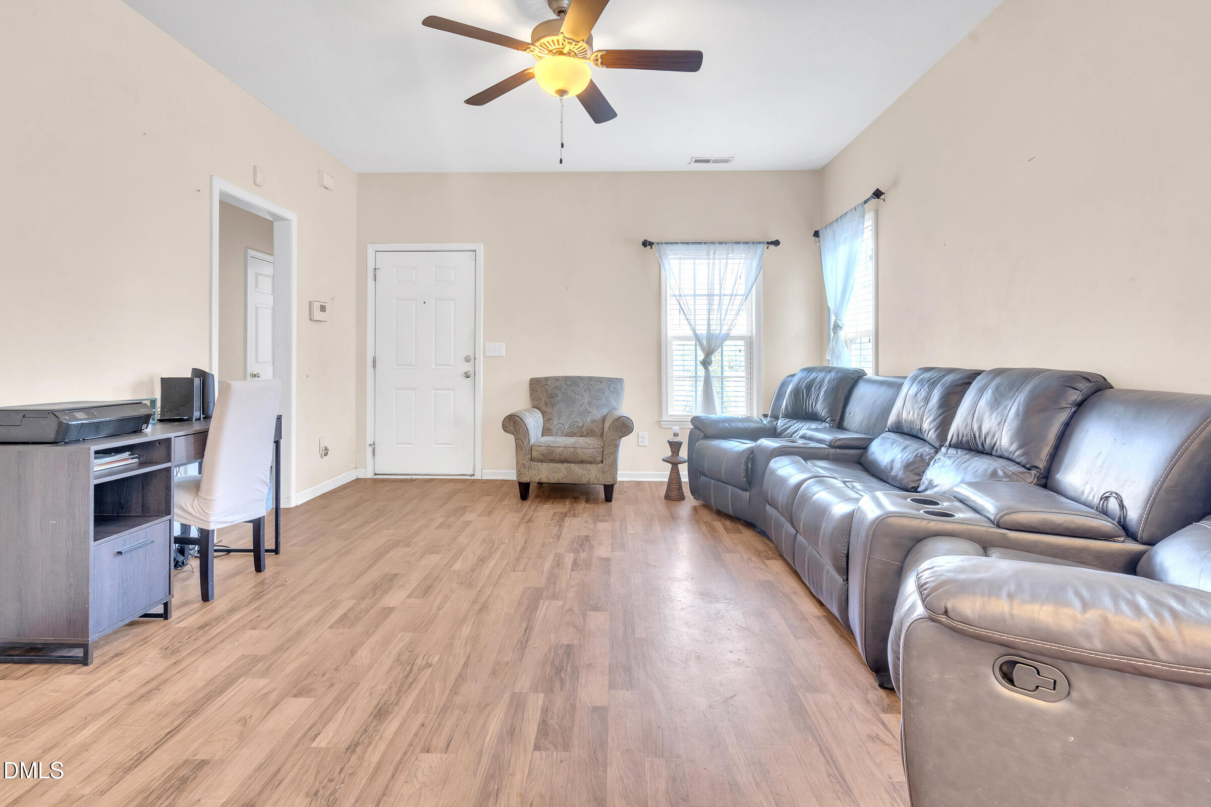 904 East Jones Street Raleigh, NC 27601 - Photo 7 of 21 a living room with furniture and a wooden floor