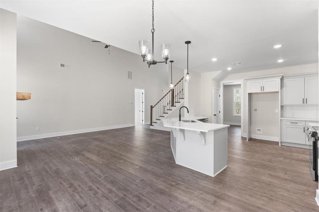 14 Everwood Court Rome, GA 30161 - Photo 24 of 54 a view of kitchen with stainless steel appliances sink refrigerator and wooden floor