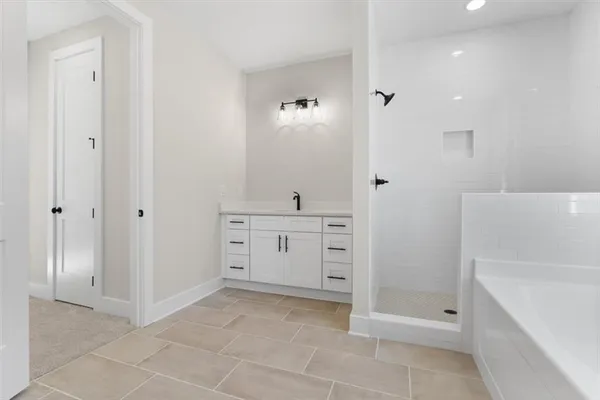 a bathroom with a double vanity sink and mirror