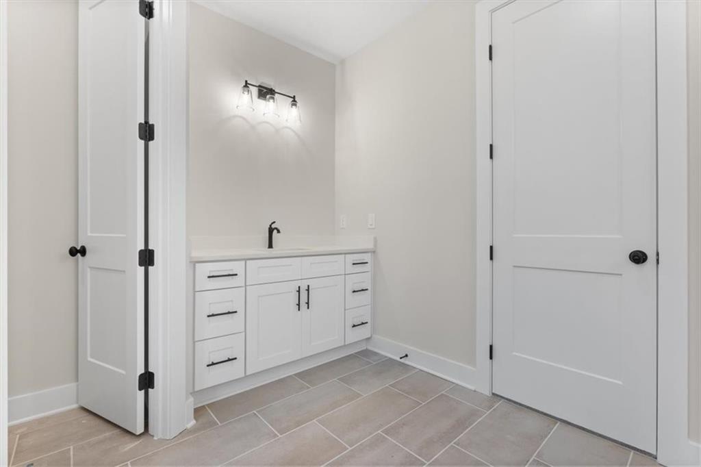 14 Everwood Court Rome, GA 30161 - Photo 29 of 54 a bathroom with a double vanity sink and mirror