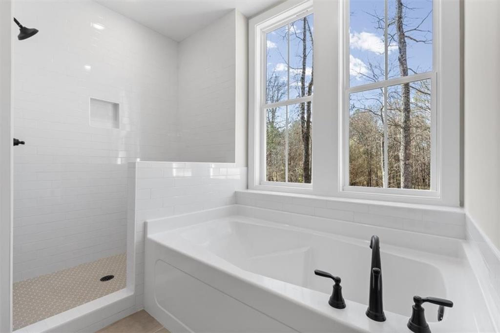 14 Everwood Court Rome, GA 30161 - Photo 32 of 54 a bathroom with a bathtub and a shower