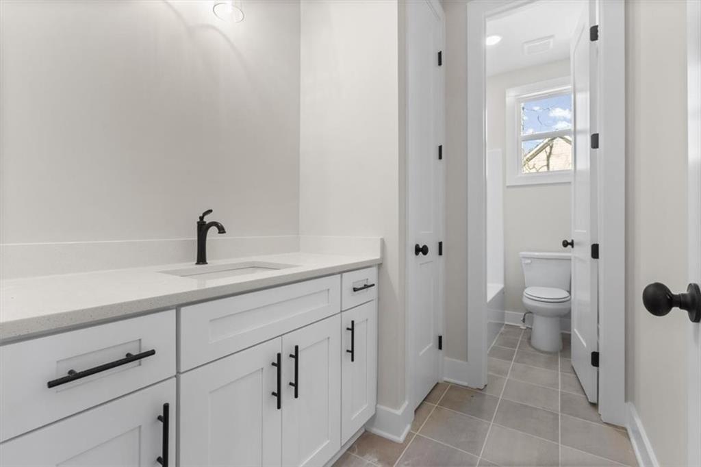 14 Everwood Court Rome, GA 30161 - Photo 37 of 54 a spacious bathroom with a toilet sink and mirror