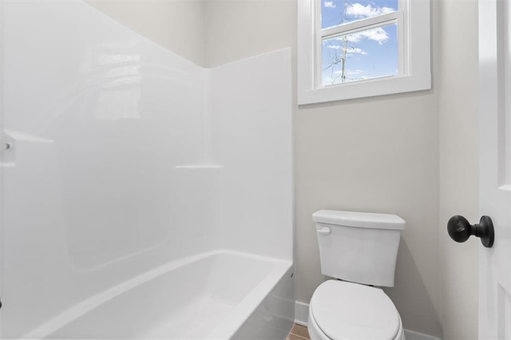 14 Everwood Court Rome, GA 30161 - Photo 38 of 54 a white toilet sitting next to a bath tub