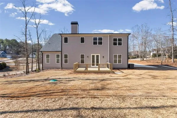 a view of a house with snow on the road