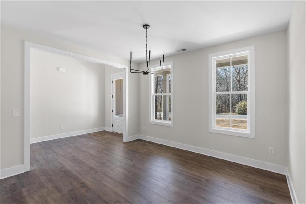 14 Everwood Court Rome, GA 30161 - Photo 9 of 54 a view of an empty room with wooden floor and a window