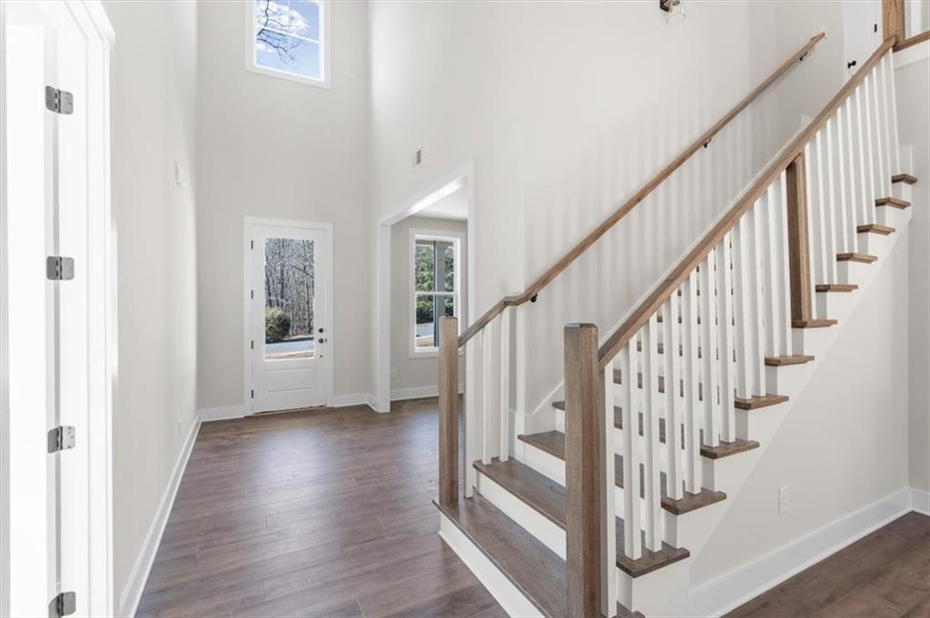 14 Everwood Court Rome, GA 30161 - Photo 10 of 54 a view of staircase with wooden floor and white walls